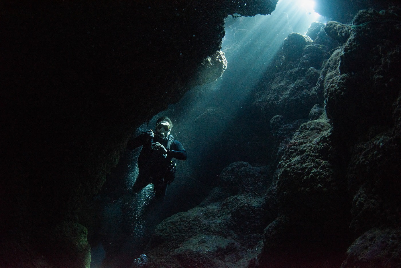 guest diving in the cave