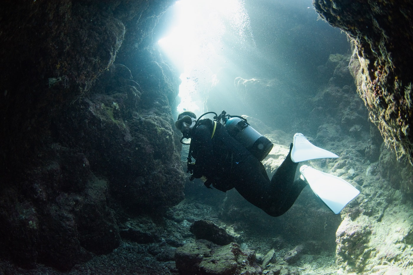 guest diving in the cave