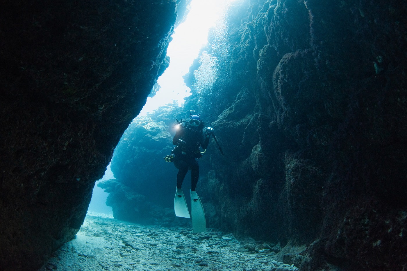 guest diving in the cave