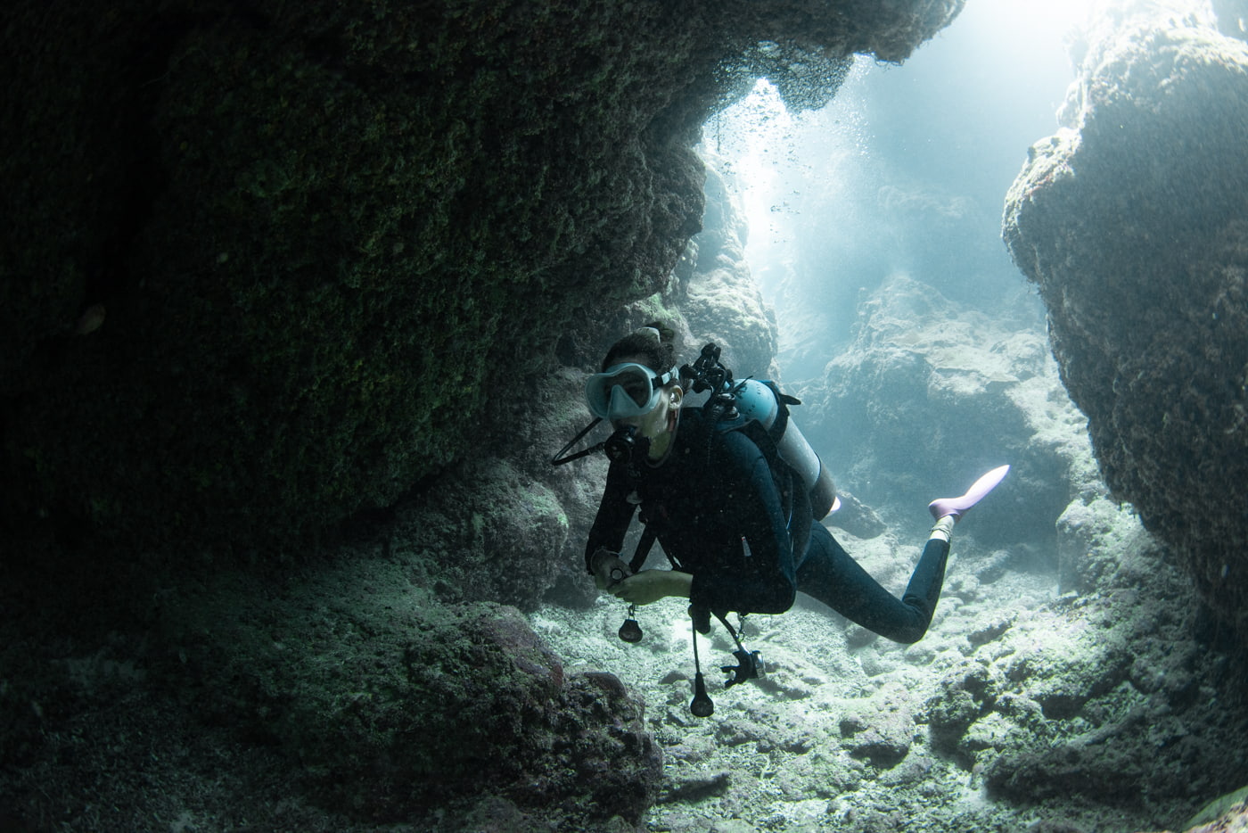 Guests diving inside a cave.