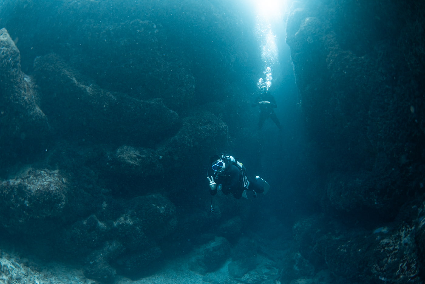 Guests diving inside a cave.