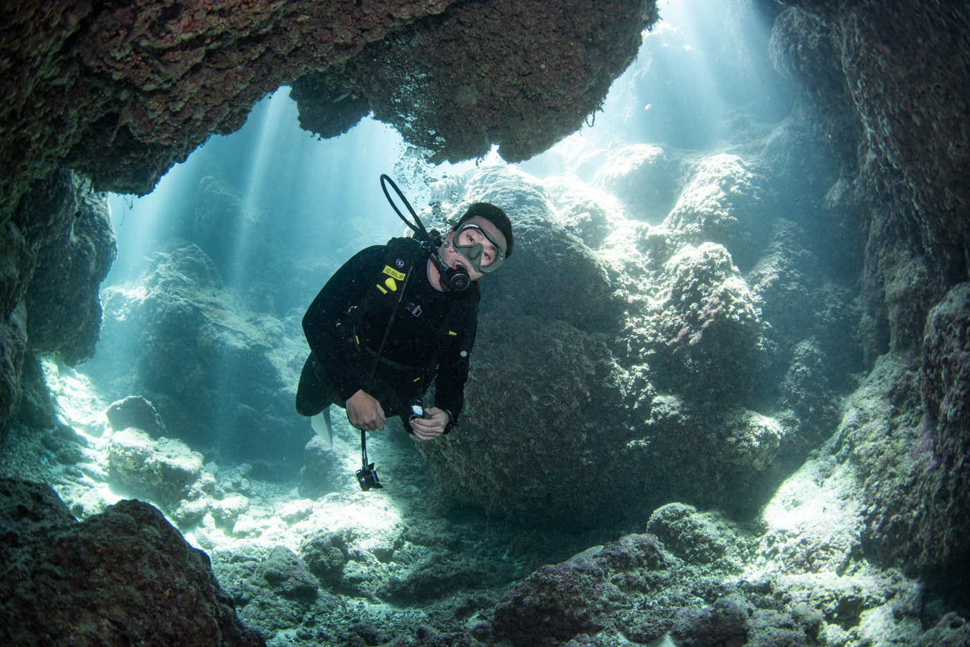 Guests diving inside a cave.