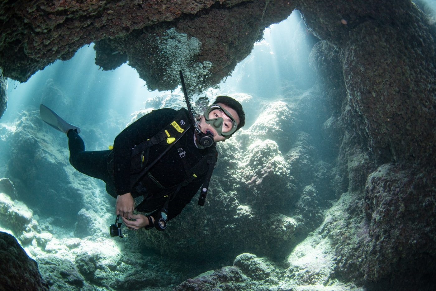 Guests diving inside a cave.
