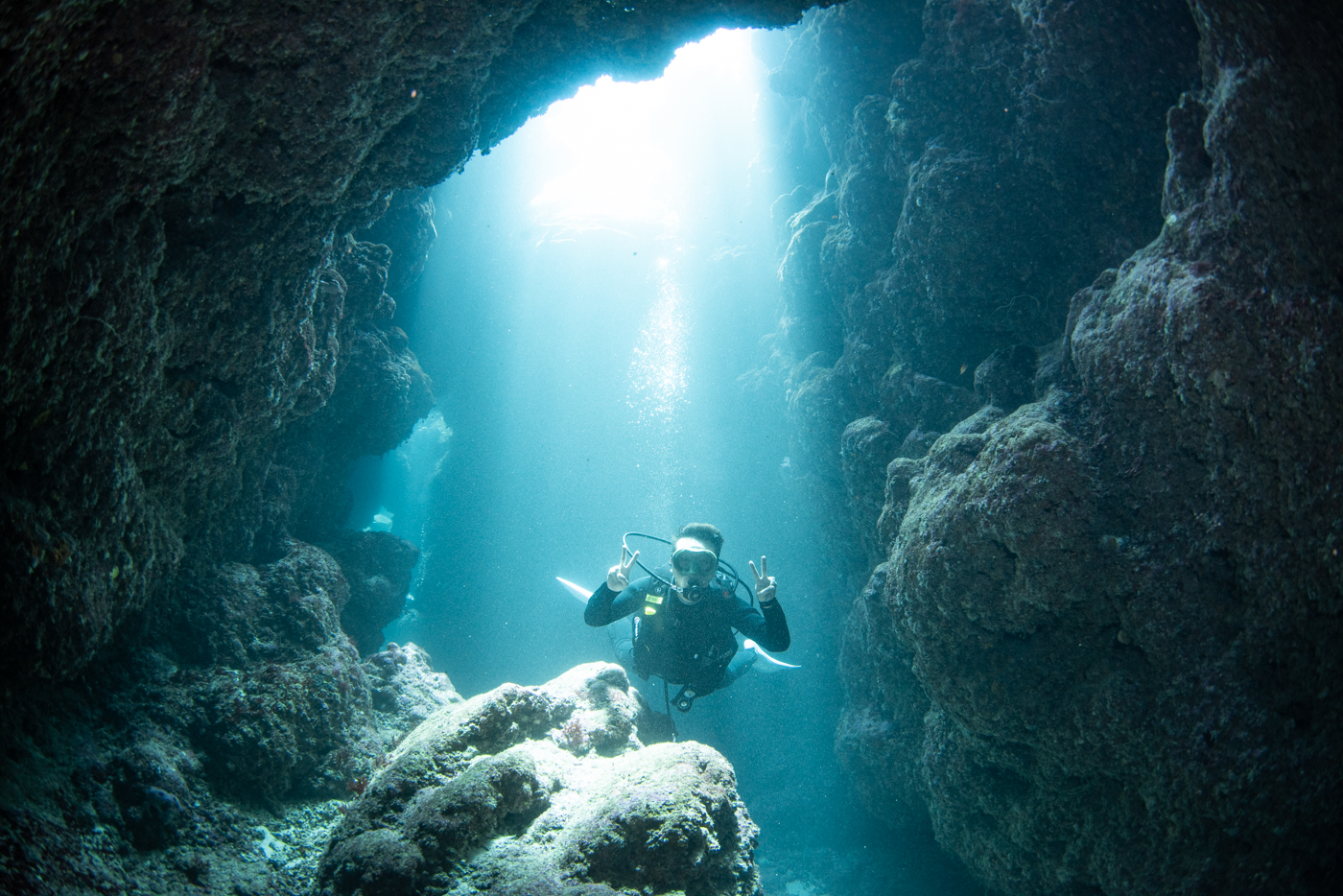 Guests diving inside a cave.