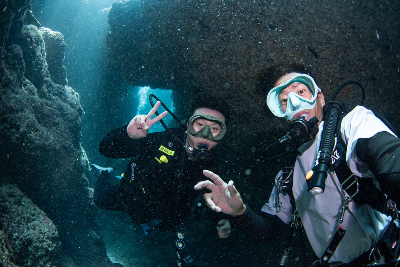 photo with guests diving inside a cave.