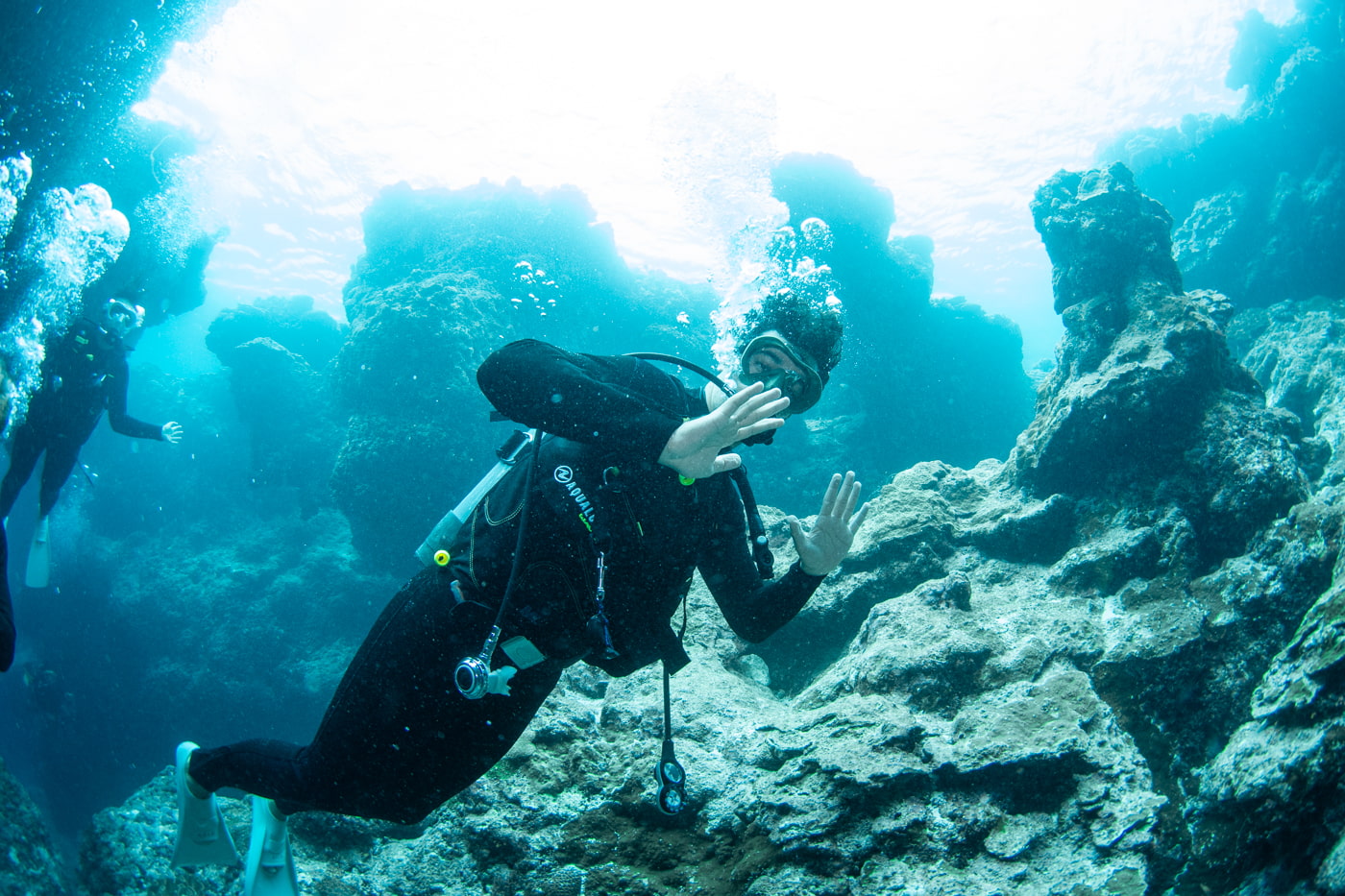 Guests diving inside a cave.
