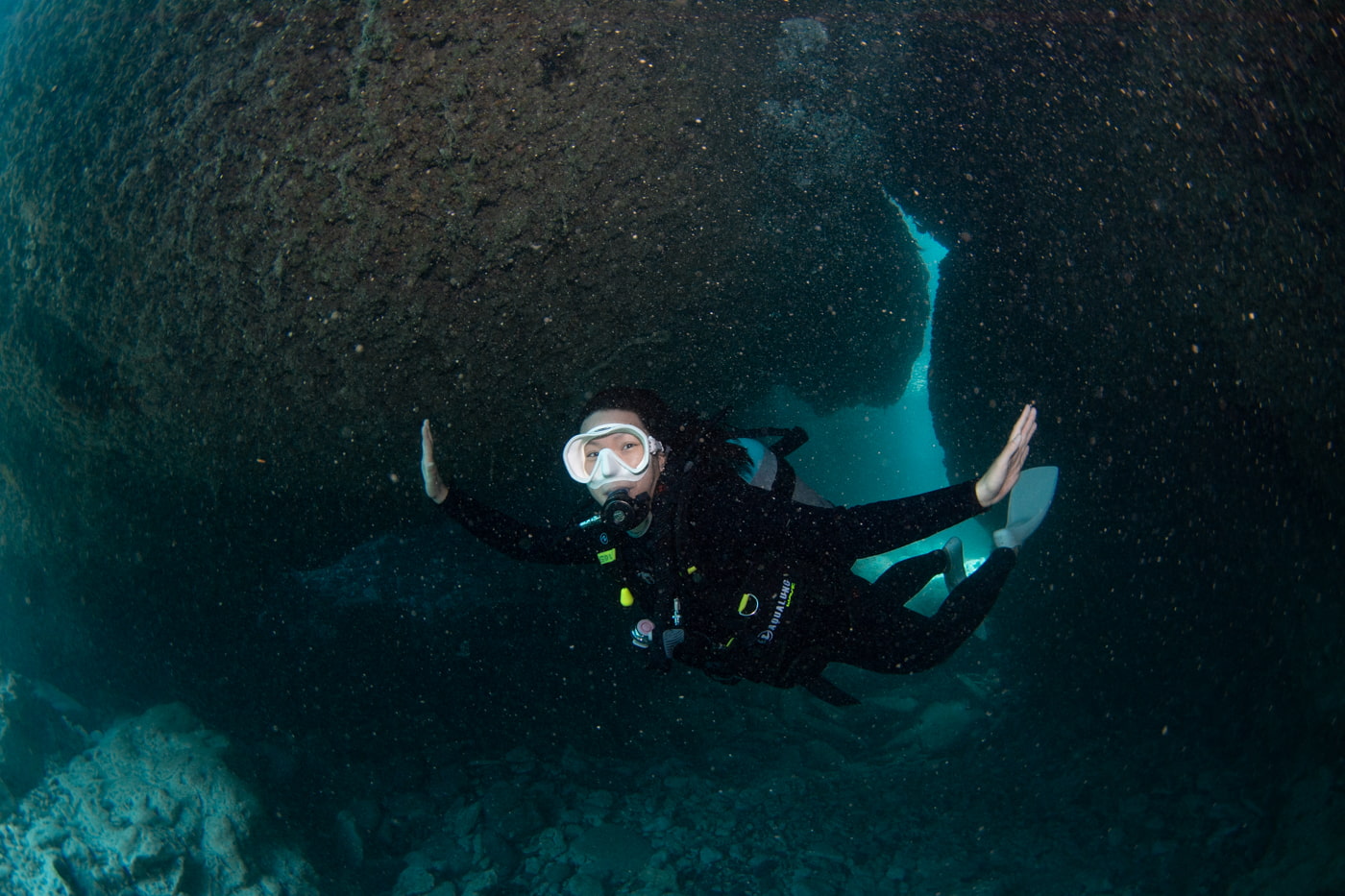 Guests diving inside a cave.