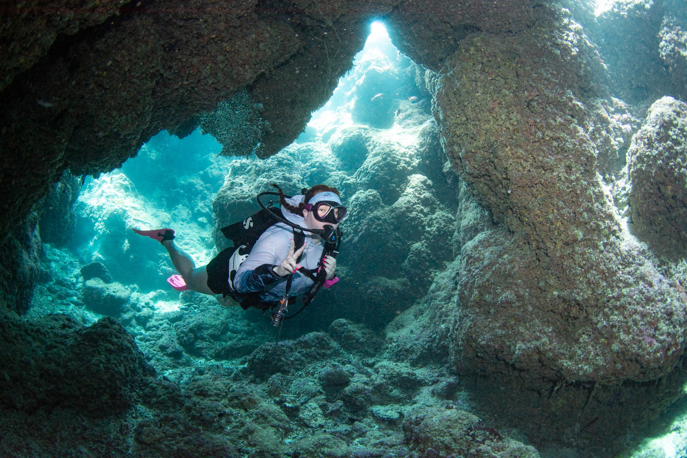 Guests diving inside a cave.