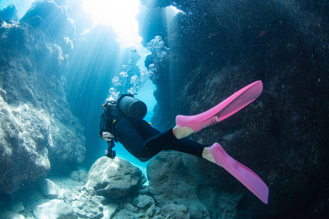 Guests diving inside a cave.