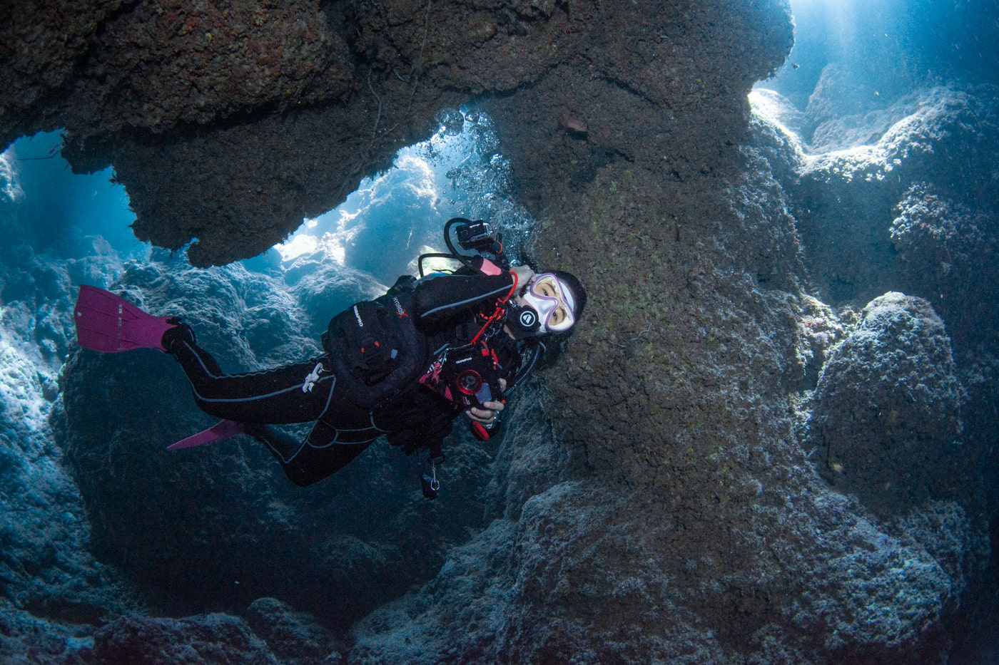 Guests diving inside a cave.