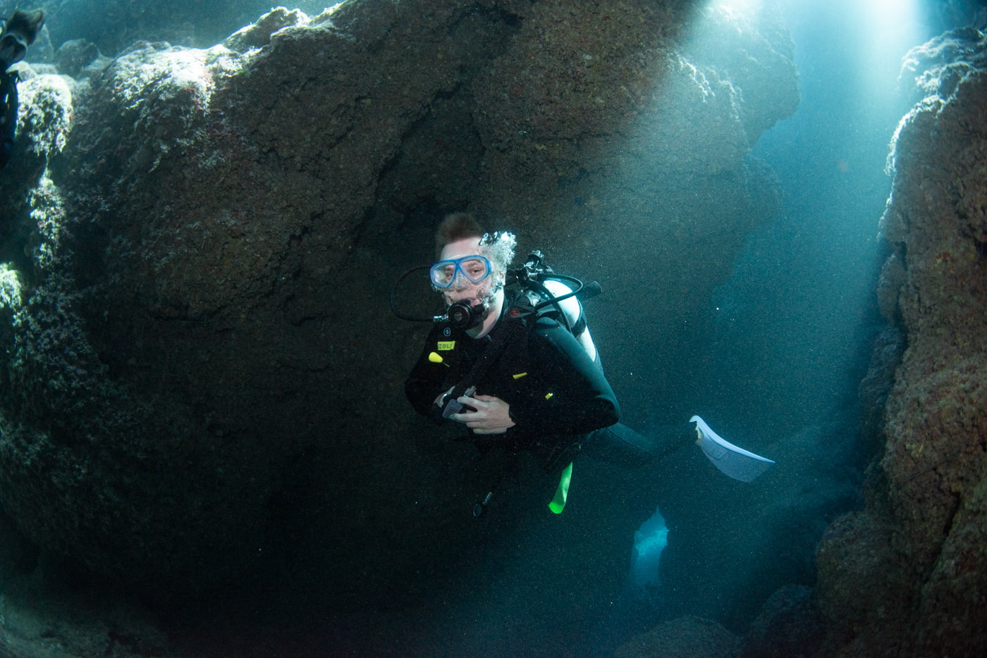 Guests diving inside a cave.
